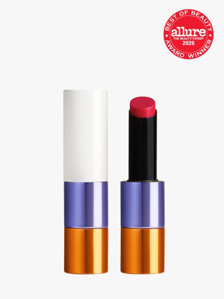 Purple, orange and white tube of Hermès Silky Lipstick Shine with Allure Best of Beauty stamp in top right corner on a light gray background